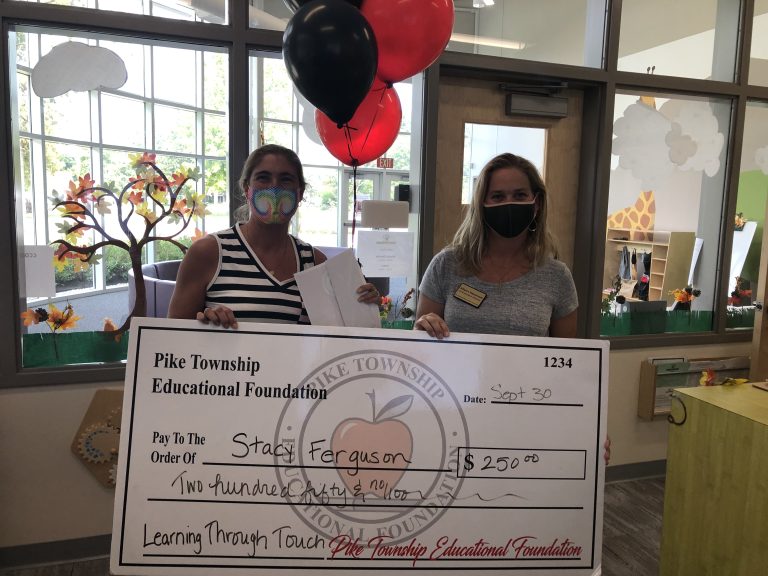 Stacy Ferguson receiving a PTEF grant for NJELC