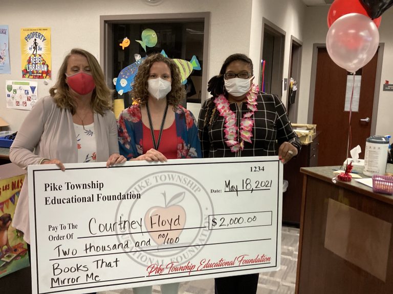 Courtney Floyd receiving a PTEF grant for Books that Mirror Me