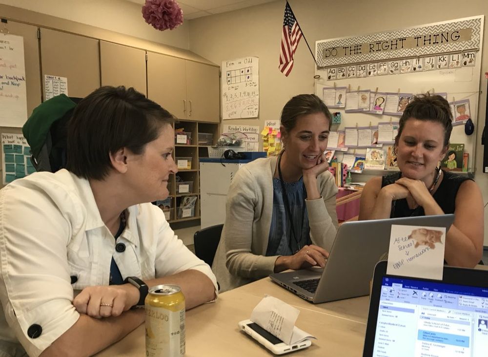 Three Pike teachers collaborating at a laptop